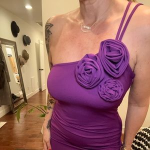 Purple Mango dress with flower detail. Open back, a slight side slit at thigh